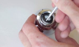 how to remove shower head flow restrictor